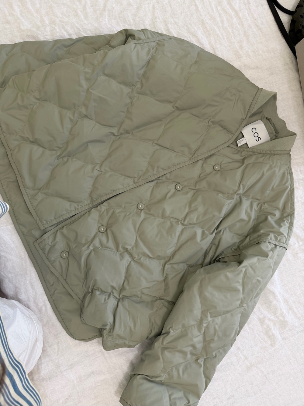 COS sage green oversized quilted jacket